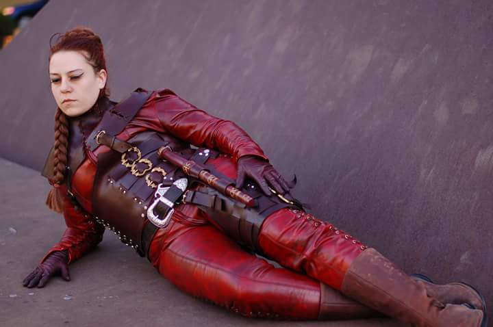 Willow lying down and dressed as a Mord-Sith from Legend of the Seeker.